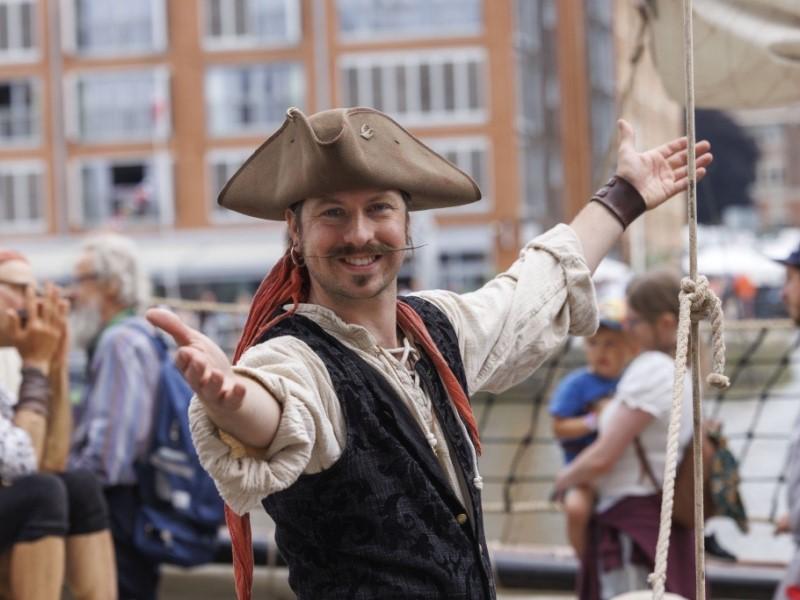A member of a Tall Ship crew welcoming you to Tall Ships.