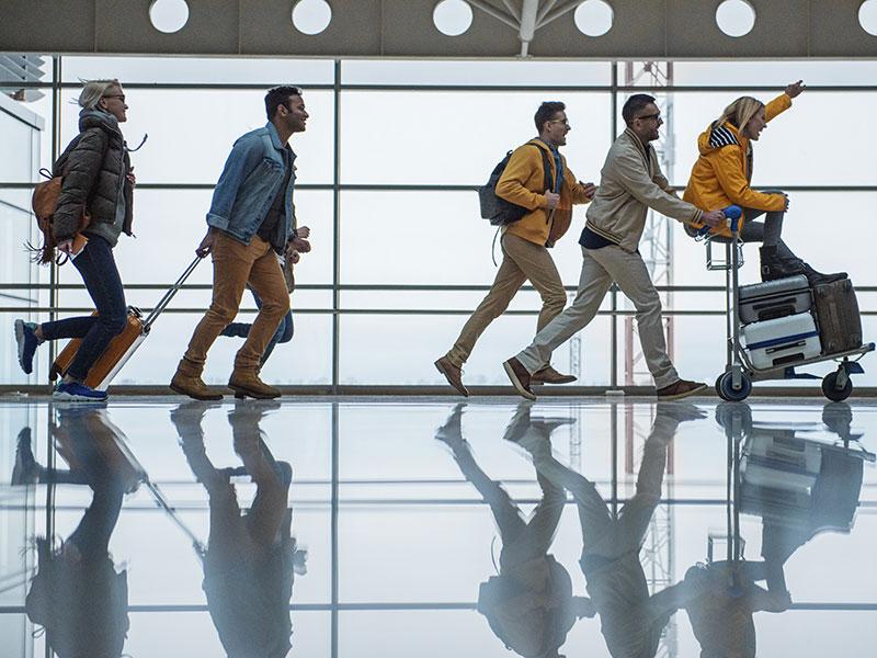 Group of people walking through a terminal