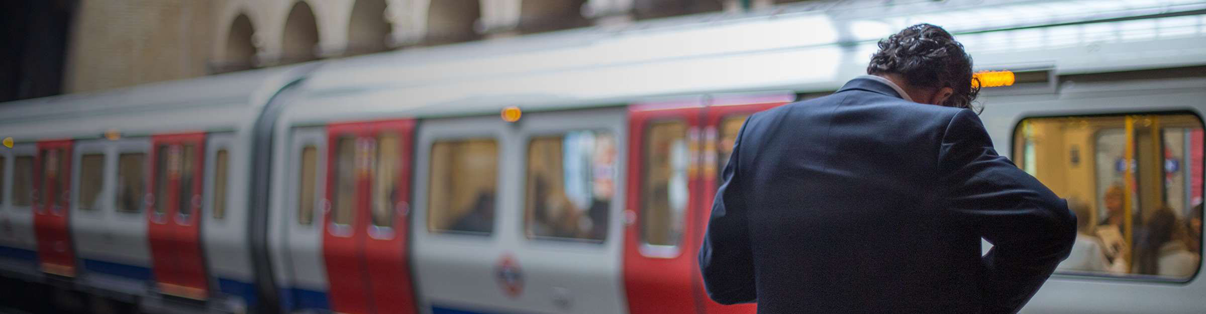 Man stood waiting for an underground train