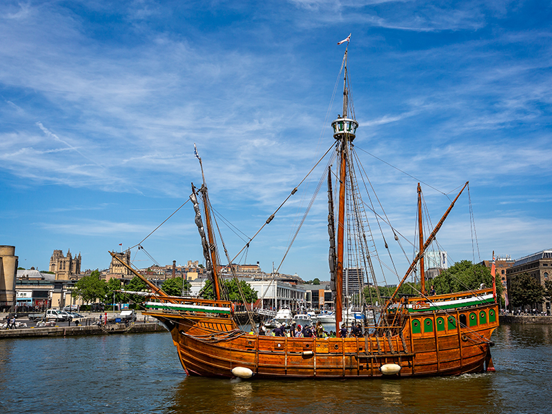 The tall ship The Matthew sailing in Bristol, with the city seen behind it