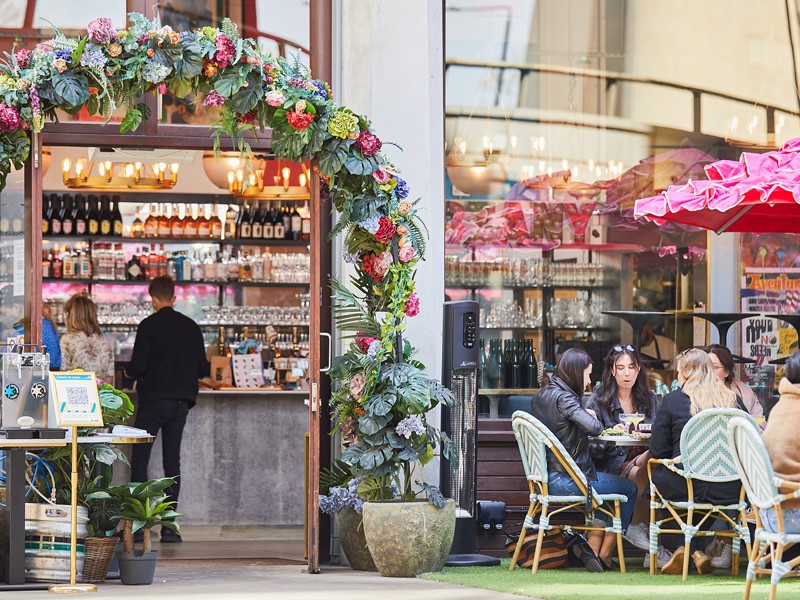 Customers sitting outside Beany Green in London Paddington
