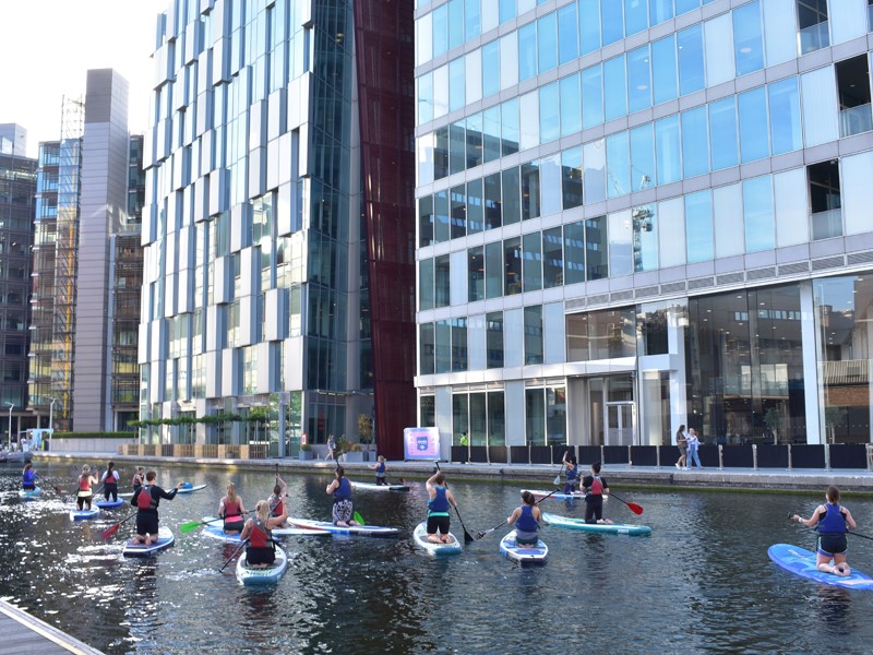 Group of paddle boarders on Paddington Basin