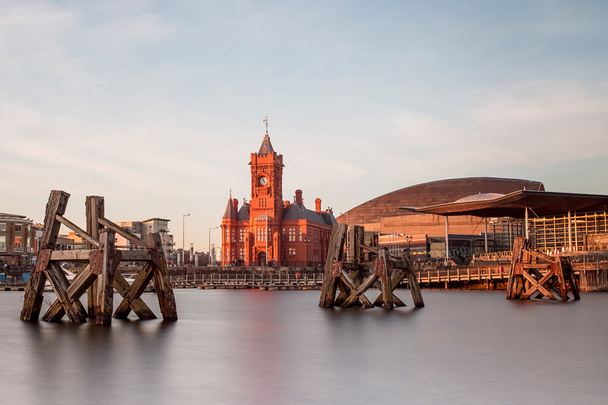 View of Cardiff Bay from the water, with the Pierhead Building and Millennium Centre in the background.