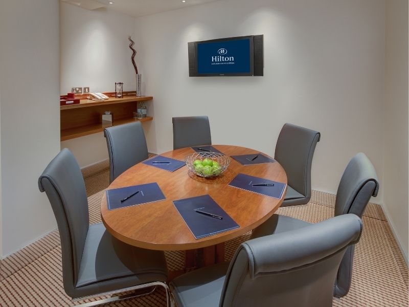 Image of table and chairs inside meeting room at the Hilton London Paddington Hotel