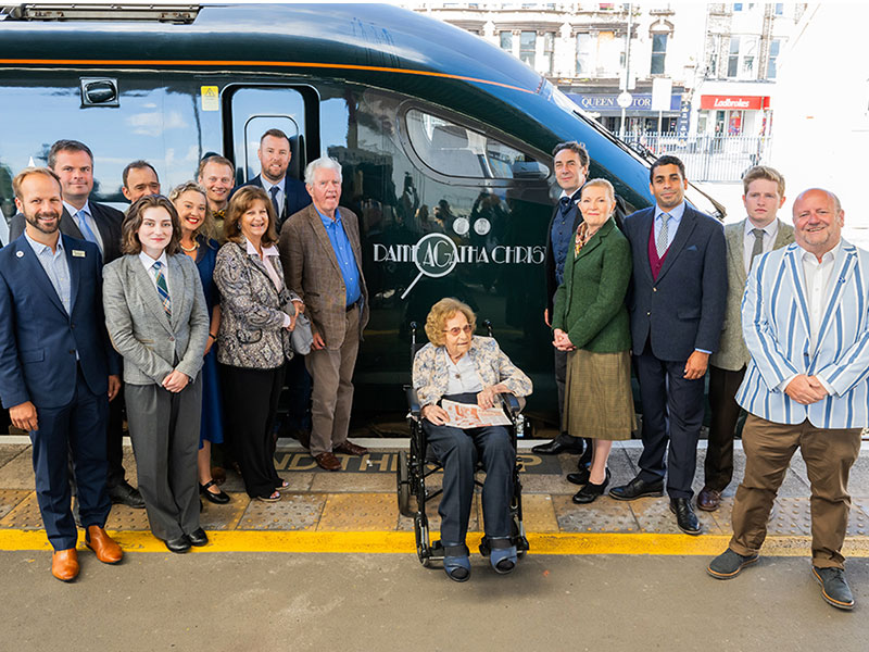 802110 train at Paignton station named after best-selling author Dame Agatha Christie, with cast of The Mousetrap and  Joan Nott, Agatha Christie expert.