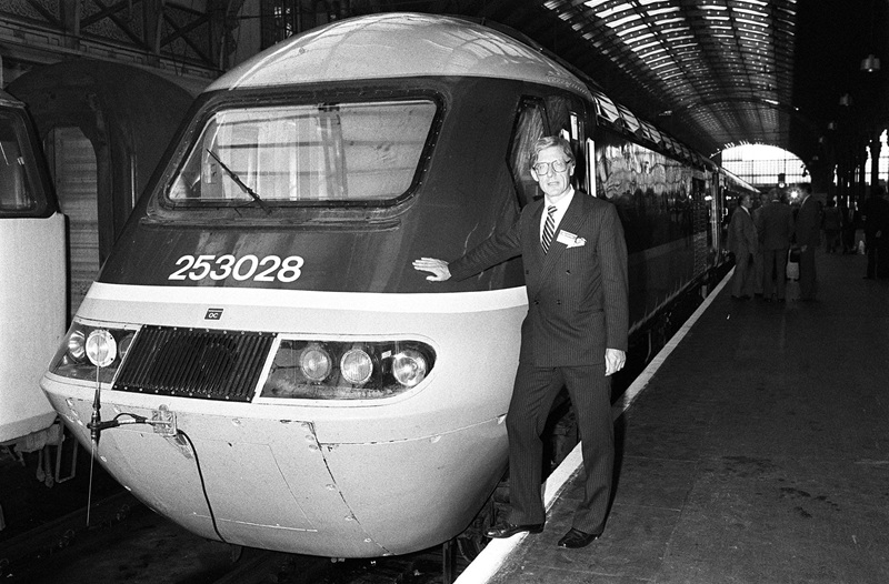 Black and white photo of Cyril Bleasdale stood next to a train at Paddington in 1983