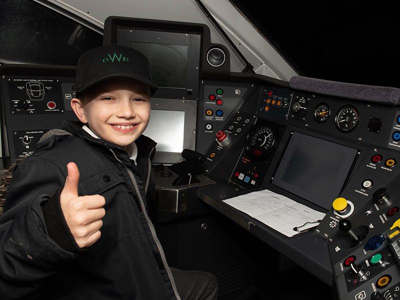 Aspiring train driver in the cab of the train