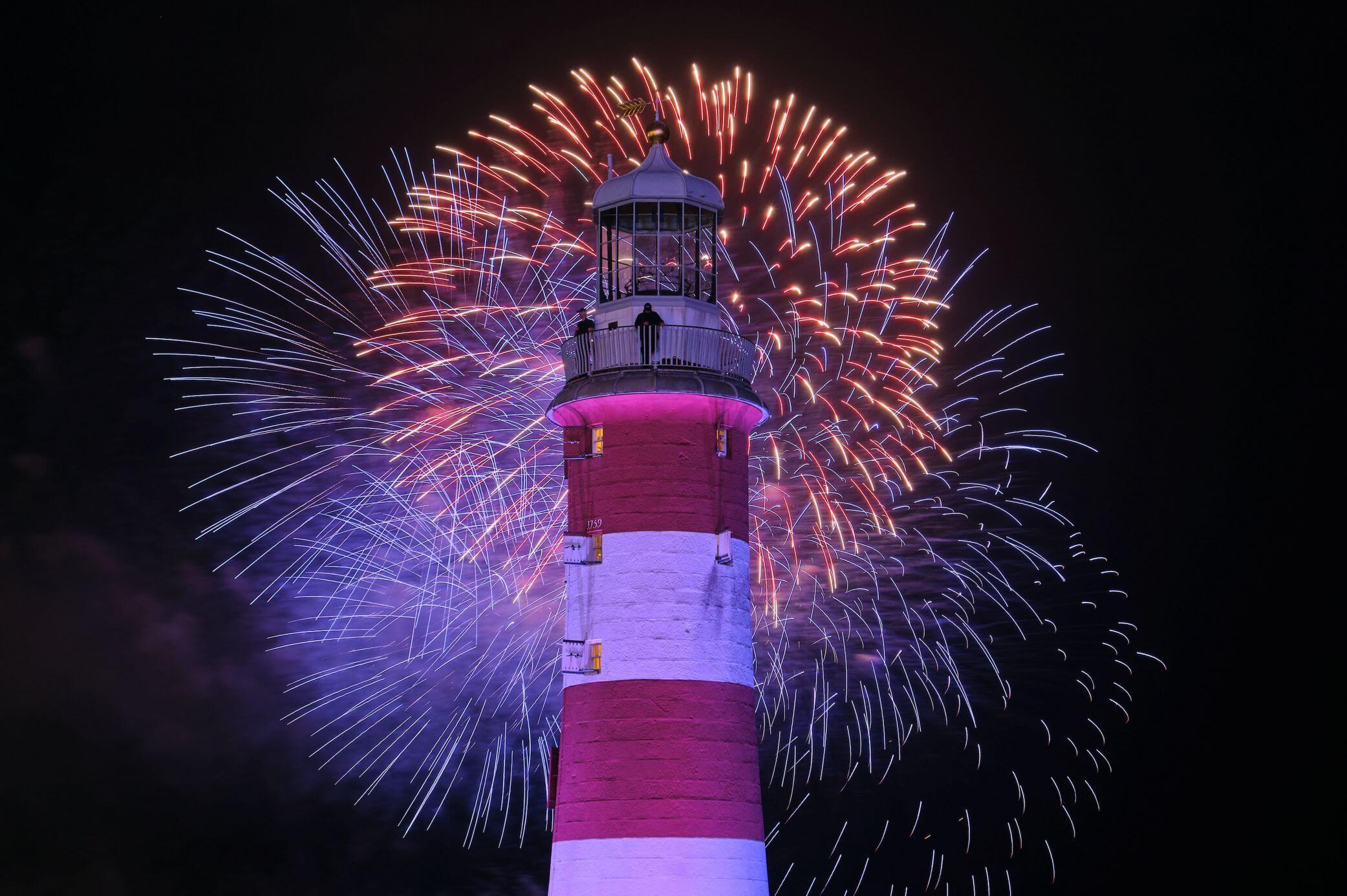 Fireworks behind the Plymouth lighthouse