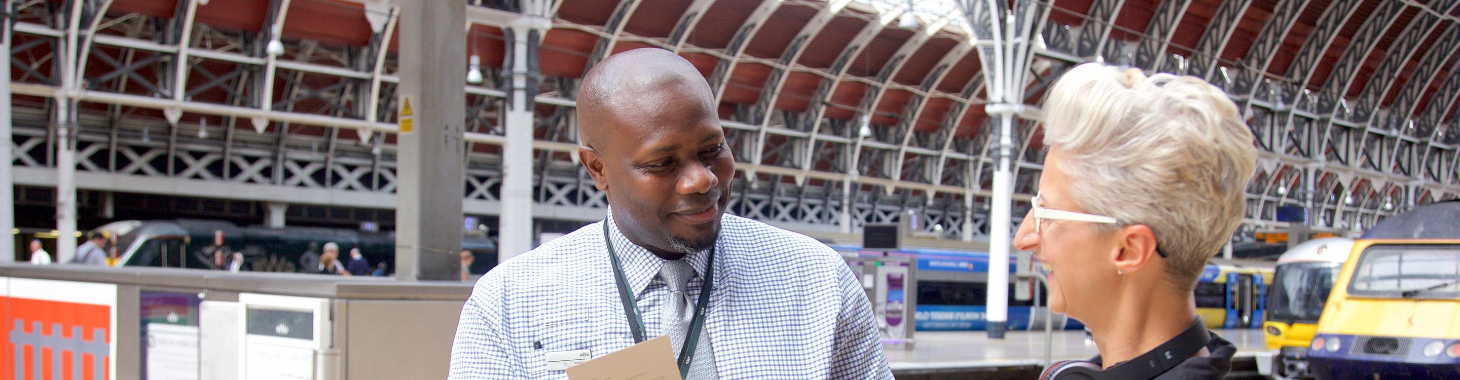 A customer Ambassador helping a customer at Paddington Station