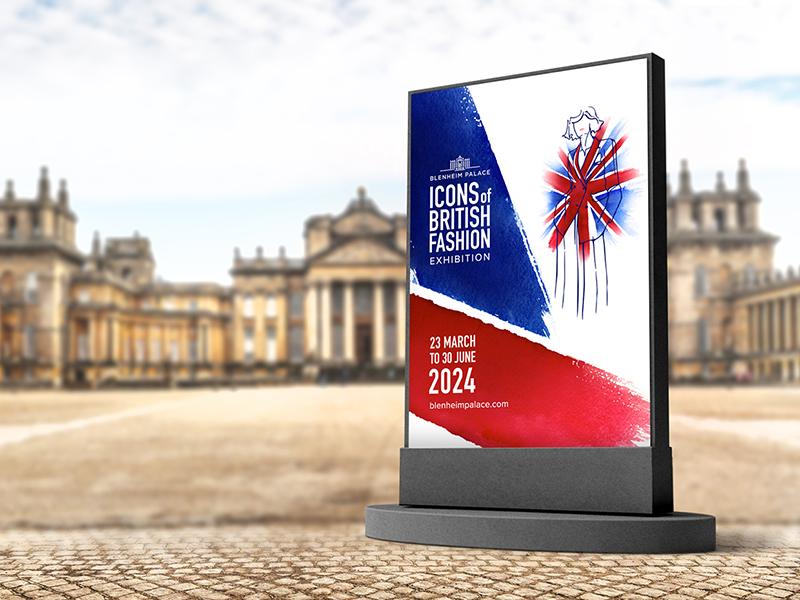 A card with the text 'ICONS of BRITISH FASHION EXHIBITION' and '23 MARCH TO 30 JUNE 2024', featuring the colours of the union jack and a pencil outline of a woman in a suit, framed against Blenheim Palace if soft focus