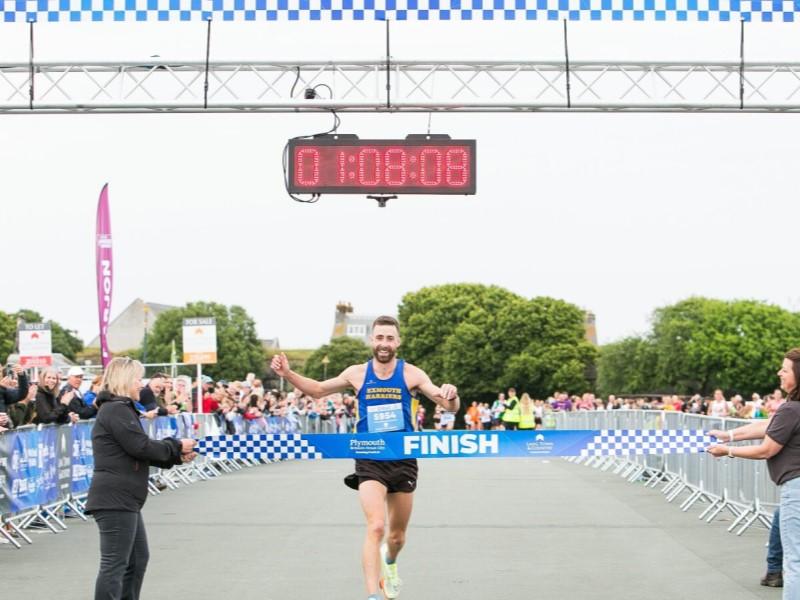 The winner of Britain's Ocean City Running Festival crosses the finish line