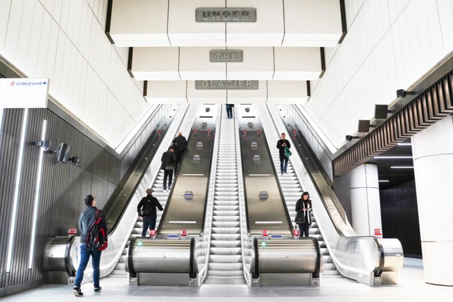 People taking the escalator on the Elizabeth line
