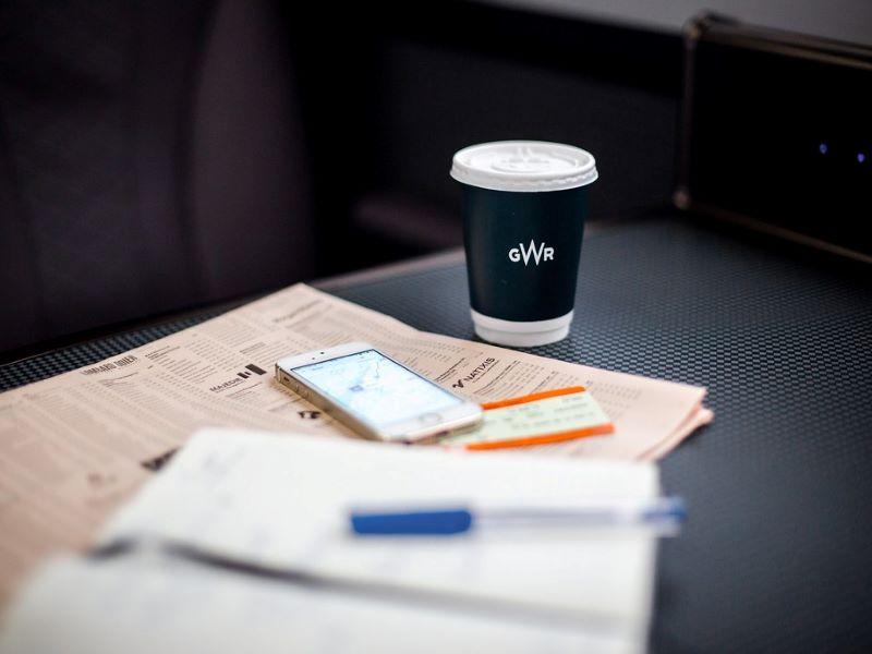 GWR train table with coffee, ticket, phone and notebook 