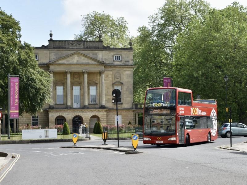 The Tootbus city tour bus, driving through the picturesque city of Bath