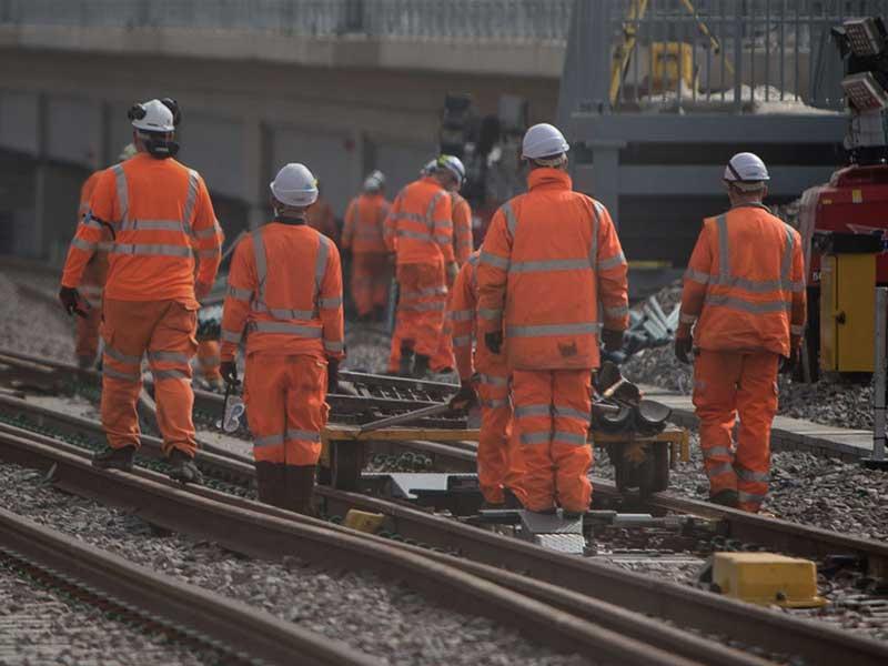 Workmen on railway tracks