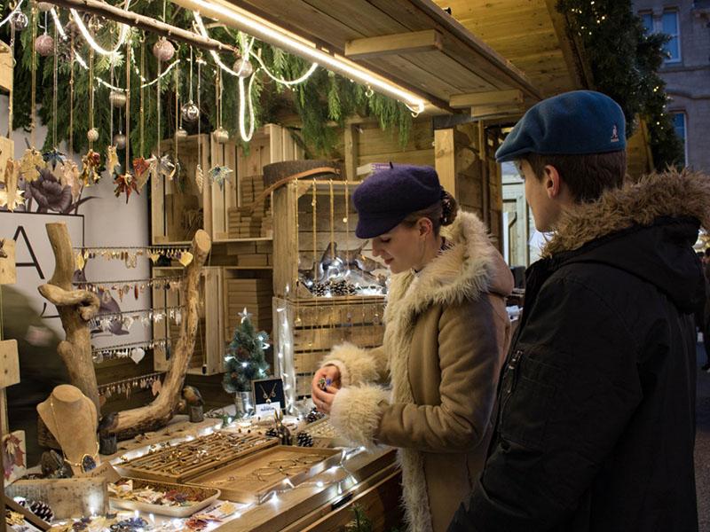 Shoppers perusing the stalls at Oxford Christmas market