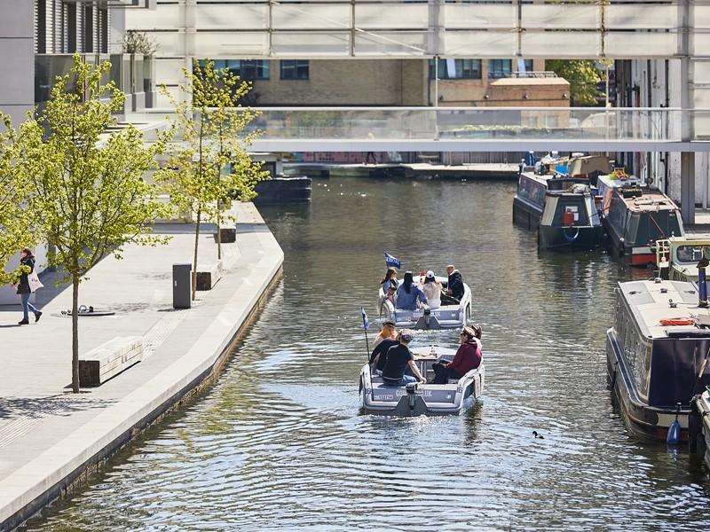 Groups of people on GoBoat's self-driving boats, exploring London Paddington
