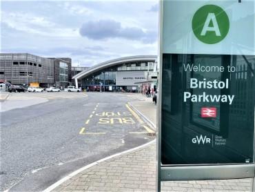 The entrance of Bristol Parkway station, framed with a sign saying 'Welcome to Bristol Parkway'.